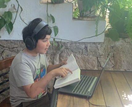 boy reading and talking